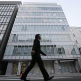 A man walks past a building where Mt. Gox, a digital marketplace operator, is housed in Tokyo February 25, 2014. REUTERS/Toru Hanai A man walks past a building where Mt. Gox, a digital marketplace operator, is housed in Tokyo February 25, 2014. REUTERS/Toru Hanai