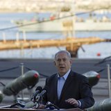 Israel's Prime Minister Benjamin Netanyahu speaks to the media in front of a display of M302 rockets, found aboard the Klos C ship, at a nav Israel's Prime Minister Benjamin Netanyahu speaks to the media in front of a display of M302 rockets, found aboard the Klos C ship, at a nav