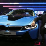 BMW CEO Norbert Reithofer poses beside the BMW i8 hybrid supercar during a media preview day at the Frankfurt Motor Show (IAA) September 10, BMW CEO Norbert Reithofer poses beside the BMW i8 hybrid supercar during a media preview day at the Frankfurt Motor Show (IAA) September 10,