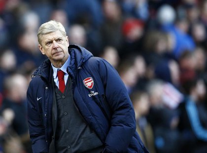 Arsenal manager Arsene Wenger walks off the pitch following their English Premier League soccer match defeat to Stoke City at the Britannia Arsenal manager Arsene Wenger walks off the pitch following their English Premier League soccer match defeat to Stoke City at the Britannia