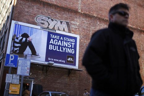 A pedestrian walks past an anti-bullying billboard in downtown Boston, Massachusetts March 3, 2011. REUTERS/Brian Snyder A pedestrian walks past an anti-bullying billboard in downtown Boston, Massachusetts March 3, 2011. REUTERS/Brian Snyder