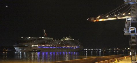 The Carnival Triumph cruise ship is towed towards the port of Mobile, Alabama, February 14, 2013. REUTERS/ Lyle Ratliff The Carnival Triumph cruise ship is towed towards the port of Mobile, Alabama, February 14, 2013. REUTERS/ Lyle Ratliff