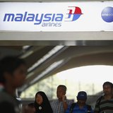 People walk under a Malaysia Airlines sign at Kuala Lumpur International Airport in Sepang March 8, 2014. REUTERS/Samsul Said People walk under a Malaysia Airlines sign at Kuala Lumpur International Airport in Sepang March 8, 2014. REUTERS/Samsul Said