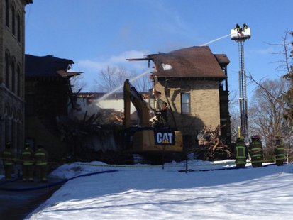 Crews tear down part of St. Joseph Hall on the St. Lawrence Seminary campus in Mount Calvary on Mar. 8, 2014. (Photo from: FOX 11). Crews tear down part of St. Joseph Hall on the St. Lawrence Seminary campus in Mount Calvary on Mar. 8, 2014. (Photo from: FOX 11).