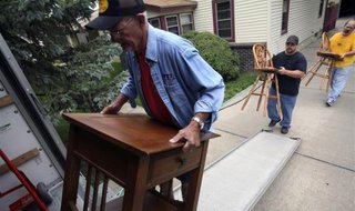 Larry Gascoigne (L) moves furniture with his grandson Corey and son Joe Gascoigne out of Joe's Council Bluffs, Iowa home, June 22, 2011.
REUTERS/Lane Hickenbottom Larry Gascoigne (L) moves furniture with his grandson Corey and son Joe Gascoigne out of Joe's Council Bluffs, Iowa home, June 22, 2011.
REUTERS/Lane Hickenbottom