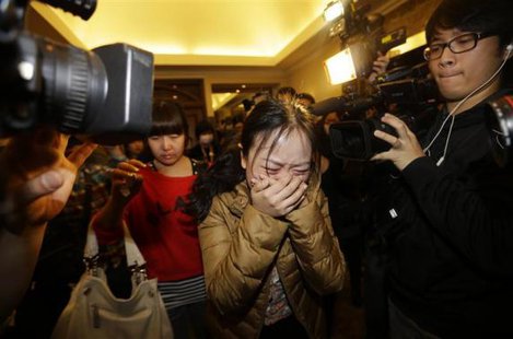 A relative (front) of a passenger of Malaysia Airlines flight MH370 cries as she walks past journalists at a hotel in Beijing March 9, 2014.
Credit: REUTERS/Jason Lee A relative (front) of a passenger of Malaysia Airlines flight MH370 cries as she walks past journalists at a hotel in Beijing March 9, 2014.
Credit: REUTERS/Jason Lee