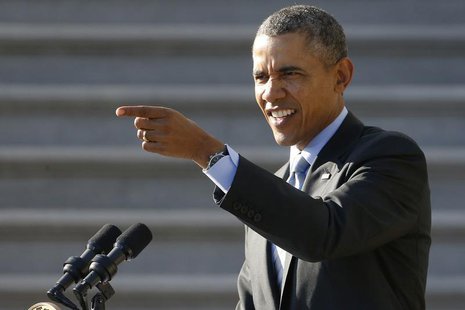 U.S. President Barack Obama points out a student taking a selfie as he arrives for remarks to welcomes NCAA champion athletes to the South L U.S. President Barack Obama points out a student taking a selfie as he arrives for remarks to welcomes NCAA champion athletes to the South L