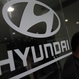 A visitor walks past a Hyundai Motor logo at a Hyundai dealership in Seoul April 25, 2013 REUTERS/Kim Hong-Ji A visitor walks past a Hyundai Motor logo at a Hyundai dealership in Seoul April 25, 2013 REUTERS/Kim Hong-Ji