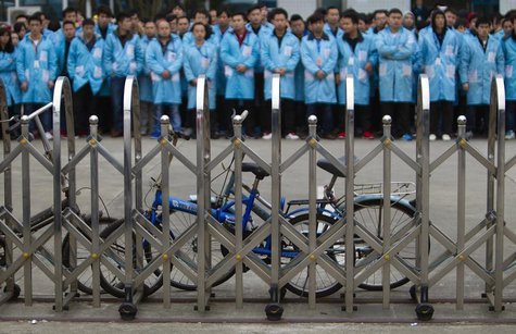 IBM workers protest at an IBM factory in Shenzhen, Guangdong province, March 7, 2014. REUTERS/Alex Lee IBM workers protest at an IBM factory in Shenzhen, Guangdong province, March 7, 2014. REUTERS/Alex Lee