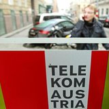 A man talks on his mobile phone outside a Telekom Austria phone booth in Vienna January 9, 2014. REUTERS/Heinz-Peter Bader A man talks on his mobile phone outside a Telekom Austria phone booth in Vienna January 9, 2014. REUTERS/Heinz-Peter Bader