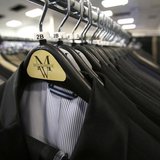 Suits hang on a rack at a Men's Wearhouse store in Pasadena, California June 25, 2013. REUTERS/Mario Anzuoni Suits hang on a rack at a Men's Wearhouse store in Pasadena, California June 25, 2013. REUTERS/Mario Anzuoni