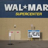 A man stands on a skateboard outside a Wal-Mart store in Williston, North Dakota March 13, 2013. REUTERS/Shannon Stapleton A man stands on a skateboard outside a Wal-Mart store in Williston, North Dakota March 13, 2013. REUTERS/Shannon Stapleton