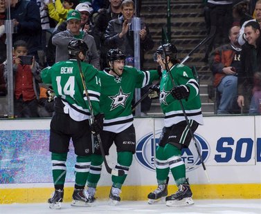 Jan 23, 2014; Dallas, TX, USA; Dallas Stars left wing Jamie Benn (14) and center Rich Peverley (17) and defenseman Brenden Dillon (4) celebr Jan 23, 2014; Dallas, TX, USA; Dallas Stars left wing Jamie Benn (14) and center Rich Peverley (17) and defenseman Brenden Dillon (4) celebr