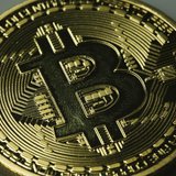 A mock Bitcoin is displayed on a table in an illustration picture taken in Berlin January 7, 2014. REUTERS/Pawel Kopczynski A mock Bitcoin is displayed on a table in an illustration picture taken in Berlin January 7, 2014. REUTERS/Pawel Kopczynski