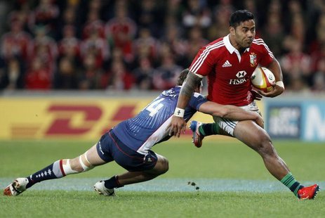 British and Irish Lions player Manu Tuilagi (R) is tackled by Tom English from the Melbourne Rebels during their rugby game in Melbourne Jun British and Irish Lions player Manu Tuilagi (R) is tackled by Tom English from the Melbourne Rebels during their rugby game in Melbourne Jun