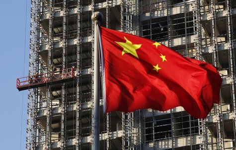 A Chinese national flag flutters at a construction site for a new residence complex in Beijing November 4, 2013. REUTERS/Kim Kyung-Hoon A Chinese national flag flutters at a construction site for a new residence complex in Beijing November 4, 2013. REUTERS/Kim Kyung-Hoon