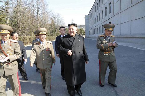North Korean leader Kim Jong Un (C) visits the Kim Il Sung University of Politics to take part in the election of a deputy to the Supreme Pe North Korean leader Kim Jong Un (C) visits the Kim Il Sung University of Politics to take part in the election of a deputy to the Supreme Pe
