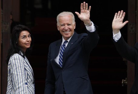 U.S. Vice President Joe Biden (C) waves to the media before a meeting with Chile's President-elect Michelle Bachelet (not pictured) in Santi U.S. Vice President Joe Biden (C) waves to the media before a meeting with Chile's President-elect Michelle Bachelet (not pictured) in Santi