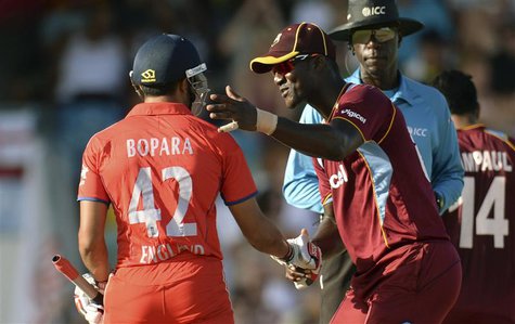 West Indies' Darren Sammy shakes hands with England's Ravi Bopara (L) during the first T20 international cricket match at Kensington Oval in West Indies' Darren Sammy shakes hands with England's Ravi Bopara (L) during the first T20 international cricket match at Kensington Oval in