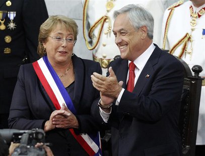 Chile's President Michelle Bachelet (L) and outgoing President Sebastian Pinera applaud after Bachelet was sworn in to office in Valparaiso, Chile's President Michelle Bachelet (L) and outgoing President Sebastian Pinera applaud after Bachelet was sworn in to office in Valparaiso,