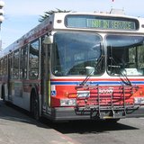 City bus (A New Flyer D40LF with bike rack, during a layover via WikiCommons.com) City bus (A New Flyer D40LF with bike rack, during a layover via WikiCommons.com)