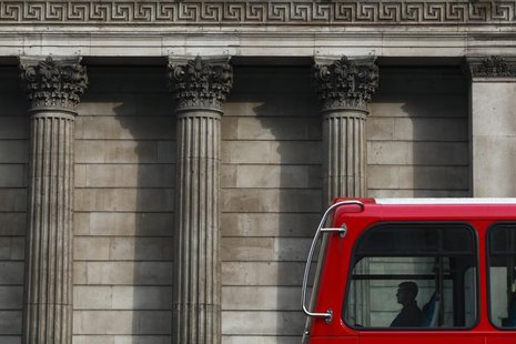 A man travels in a double-decker bus as it passes the Bank of England in central London March 24, 2010. REUTERS/Darrin Zammit Lupi A man travels in a double-decker bus as it passes the Bank of England in central London March 24, 2010. REUTERS/Darrin Zammit Lupi