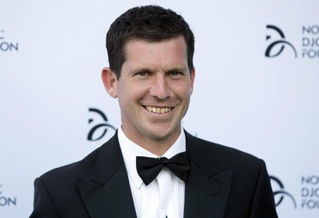 Former tennis player Tim Henman poses for photographers as he arrives at a fundraising dinner for the Novak Djokovic Foundation in London Ju Former tennis player Tim Henman poses for photographers as he arrives at a fundraising dinner for the Novak Djokovic Foundation in London Ju