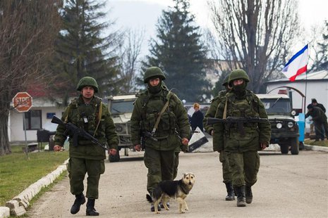 Armed men, believed to be Russian servicemen, march outside an Ukrainian military base in the village of Perevalnoye near the Crimean city o Armed men, believed to be Russian servicemen, march outside an Ukrainian military base in the village of Perevalnoye near the Crimean city o