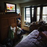 A young child watches television in an NYCHA apartment after receiving electricity just minutes before for the first time following Hurrican A young child watches television in an NYCHA apartment after receiving electricity just minutes before for the first time following Hurrican