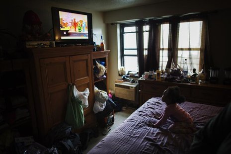 A young child watches television in an NYCHA apartment after receiving electricity just minutes before for the first time following Hurrican A young child watches television in an NYCHA apartment after receiving electricity just minutes before for the first time following Hurrican