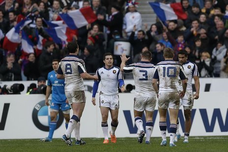 French players react after scoring a try against Italy during their Six Nations rugby union match at the Stade de France in Saint-Denis, nea French players react after scoring a try against Italy during their Six Nations rugby union match at the Stade de France in Saint-Denis, nea
