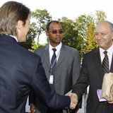 French Finance Minister Francois Baroin (L) shakes hands with socialist party member Laurent Fabius (R) as Ivory Coast's Thierry Tanoh (C), French Finance Minister Francois Baroin (L) shakes hands with socialist party member Laurent Fabius (R) as Ivory Coast's Thierry Tanoh (C),