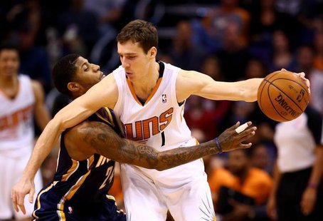 Jan 22, 2014; Phoenix, AZ, USA; Phoenix Suns guard Goran Dragic (right) controls the ball against Indiana Pacers forward Paul George in the Jan 22, 2014; Phoenix, AZ, USA; Phoenix Suns guard Goran Dragic (right) controls the ball against Indiana Pacers forward Paul George in the