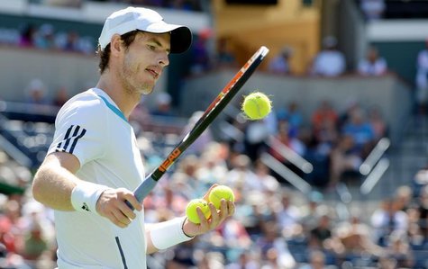 Mar 12, 2014; Indian Wells, CA, USA; Andy Murray (GBR) selects tennis balls as he prepares to serve during his match against Milos Raonic (n Mar 12, 2014; Indian Wells, CA, USA; Andy Murray (GBR) selects tennis balls as he prepares to serve during his match against Milos Raonic (n