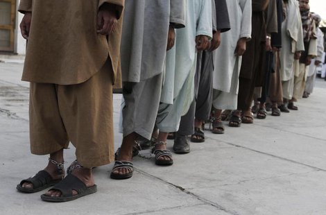 Prisoners who escaped from Kandahar's Sarposa jail on Monday are presented to the media after they were recaptured, in Kandahar April 26, 20 Prisoners who escaped from Kandahar's Sarposa jail on Monday are presented to the media after they were recaptured, in Kandahar April 26, 20