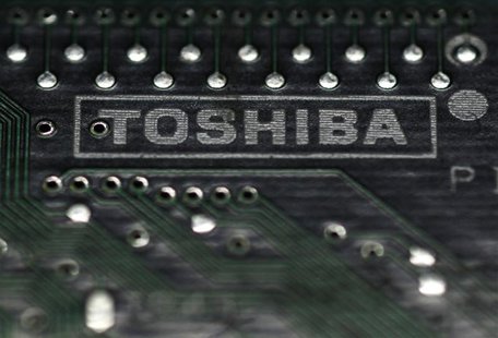 A logo of Toshiba Corp is seen on a printed circuit board in this photo illustration taken in Tokyo July 31, 2012. REUTERS/Yuriko Nakao A logo of Toshiba Corp is seen on a printed circuit board in this photo illustration taken in Tokyo July 31, 2012. REUTERS/Yuriko Nakao