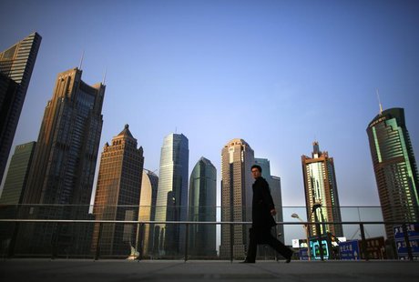 A man walks at the financial district of Pudong in Shanghai March 11, 2014. REUTERS/Carlos Barria A man walks at the financial district of Pudong in Shanghai March 11, 2014. REUTERS/Carlos Barria