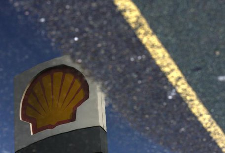 A Shell petrol station sign is reflected in a puddle in London April 28, 2009. REUTERS/Luke MacGregor A Shell petrol station sign is reflected in a puddle in London April 28, 2009. REUTERS/Luke MacGregor