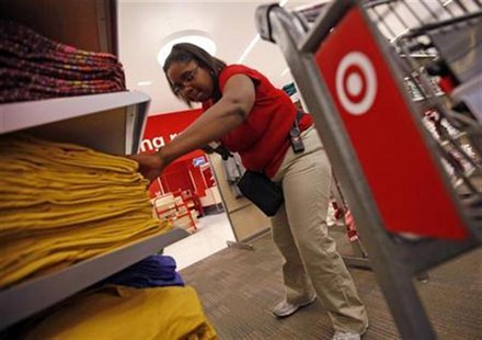 An employee at the new CityTarget store checks stock on the shelves during preparations for its opening in downtown Chicago July 18, 2012. R An employee at the new CityTarget store checks stock on the shelves during preparations for its opening in downtown Chicago July 18, 2012. R