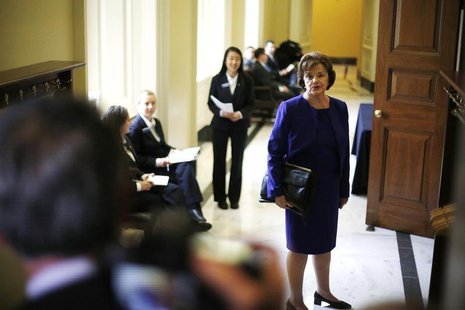 U.S. Senator Dianne Feinstein (D-CA) turns to talk to reporters as she walks to the weekly Democratic caucus policy luncheon at the U.S. Cap U.S. Senator Dianne Feinstein (D-CA) turns to talk to reporters as she walks to the weekly Democratic caucus policy luncheon at the U.S. Cap