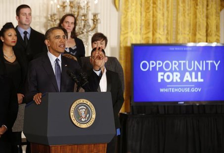 U.S. President Barack Obama talks before signing a Presidential Memorandum on modernizing the overtime system to help insure workers are pai U.S. President Barack Obama talks before signing a Presidential Memorandum on modernizing the overtime system to help insure workers are pai