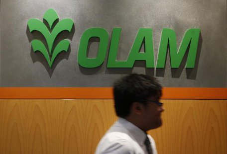 A man walks past a logo of Olam International Limited at its office in Singapore November 29, 2012. REUTERS/Edgar Su A man walks past a logo of Olam International Limited at its office in Singapore November 29, 2012. REUTERS/Edgar Su