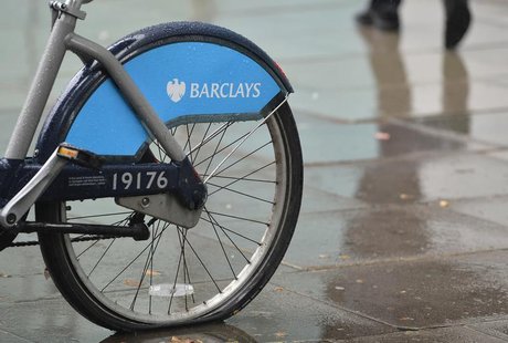 A man walks past a rental bicycle sponsored by Barclays in London July 30, 2013. REUTERS/Toby Melville A man walks past a rental bicycle sponsored by Barclays in London July 30, 2013. REUTERS/Toby Melville