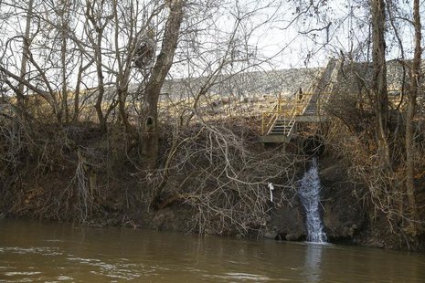 Water is seen draining into the Dan River from a coal ash pond at the site of the Duke Energy coal-fired power plant in Eden, North Carolina Water is seen draining into the Dan River from a coal ash pond at the site of the Duke Energy coal-fired power plant in Eden, North Carolina