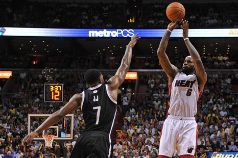 Miami Heat forward LeBron James (6) shoots over Brooklyn Nets guard Joe Johnson (7) during the second half at American Airlines Arena. Manda Miami Heat forward LeBron James (6) shoots over Brooklyn Nets guard Joe Johnson (7) during the second half at American Airlines Arena. Manda