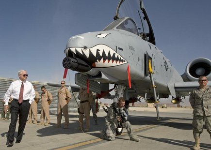 US Secretary of Defense Robert Gates (L) greets the crew and looks over an A-10 "Warthog", a close support aircraft, during an unannounced v US Secretary of Defense Robert Gates (L) greets the crew and looks over an A-10 "Warthog", a close support aircraft, during an unannounced v