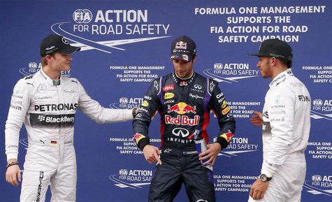 Mercedes Formula One driver Lewis Hamilton of Britain (R) celebrates taking pole position with Red Bull Formula One driver Daniel Ricciardo Mercedes Formula One driver Lewis Hamilton of Britain (R) celebrates taking pole position with Red Bull Formula One driver Daniel Ricciardo