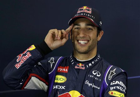 Red Bull Formula One driver Daniel Ricciardo of Australia gestures at a news conference after the qualifying session for the Australian F1 G Red Bull Formula One driver Daniel Ricciardo of Australia gestures at a news conference after the qualifying session for the Australian F1 G