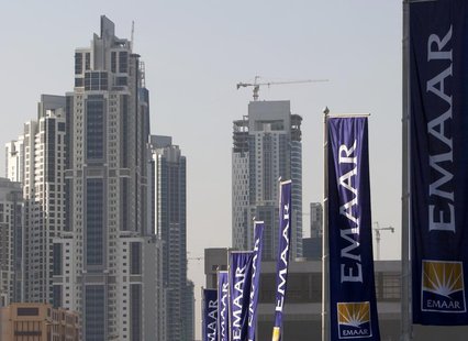 Flags for property company EMAAR, builders of Burj Dubai the world's tallest tower, are seen in Dubai, November 27, 2009. REUTERS/Steve Cris Flags for property company EMAAR, builders of Burj Dubai the world's tallest tower, are seen in Dubai, November 27, 2009. REUTERS/Steve Cris