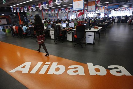 An employee walks past a logo of Alibaba Group at its headquarters on the outskirts of Hangzhou, Zhejiang province, in this May 17, 2010 fil An employee walks past a logo of Alibaba Group at its headquarters on the outskirts of Hangzhou, Zhejiang province, in this May 17, 2010 fil